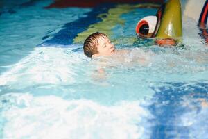 boy is in the water park. photo