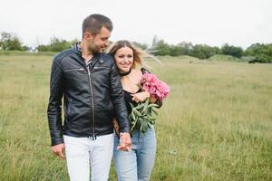 happy couple in love at sunset and smiling photo