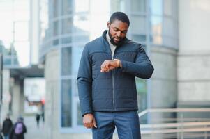 African American man in stylish new clothes on the street photo