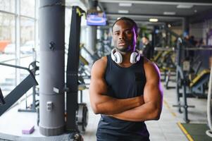 African american man standing on gym background photo