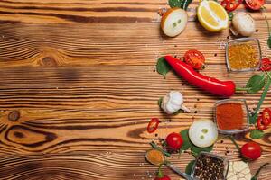 Cooking table. Background with spices and vegetables. Top view. Free space for your text. photo