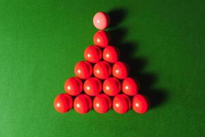 snooker balls on green surface, shallow depth of field photo