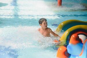 boy is in the water park. photo