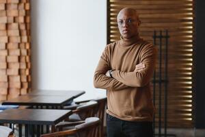 portrait of a serious african american man with glasses. photo