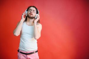 Cheerful gay man listening music. photo