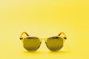 Stylish sunglasses on a yellow background High quality photo Sunglasses.