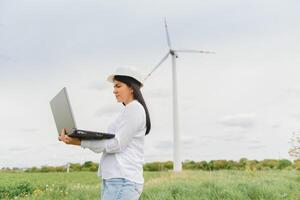 Engineer working at wind turbines photo