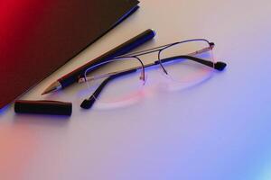 Blank notebook with pen are on top of white office desk table. Top view with copy space, flat lay. photo