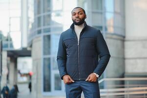 African American man in stylish new clothes on the street photo