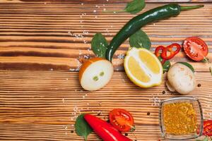 Cooking table. Background with spices and vegetables. Top view. Free space for your text. photo