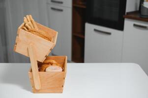 Craft wooden plate for storing bread or vegetables in the kitchen photo