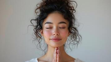 AI generated Woman With Eyes Closed and Hands Clasped photo