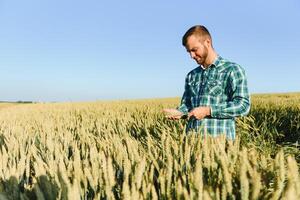 Portrait of a young handsome biologist or agronomist. photo