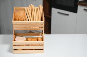 Craft wooden plate for storing bread or vegetables in the kitchen photo