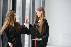 Woman portrait on her graduation day. University. Education, graduation and people concept. photo