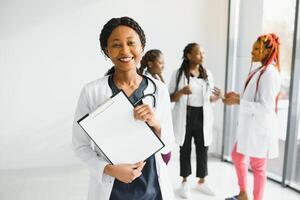 group of young african medical workers on white background. photo