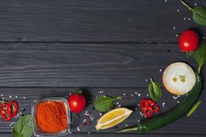 Cooking table. Background with spices and vegetables. Top view. Free space for your text. photo