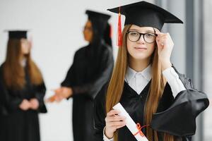 Woman portrait on her graduation day. University. Education, graduation and people concept. photo