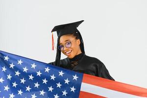 Happy female student with USA flag background. Studying in USA conceptual photo