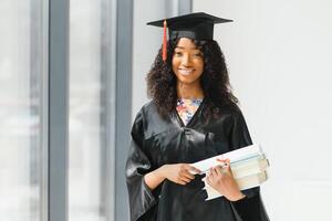 Excited African American woman at her graduation. photo