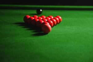 snooker balls set on a green table photo