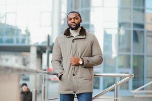 African American man in stylish new clothes on the street photo