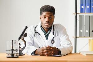 friendly african american doctor in modern office. photo