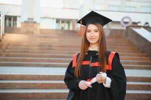 Woman portrait on her graduation day. University. Education, graduation and people concept. photo