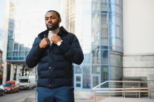 African American man in stylish new clothes on the street photo