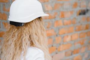 A portrait of engineer woman looking construction. Concept Engineer and business work. photo