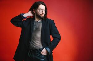 Gay man on a colored background in the studio. The concept of the LGBTQ community. Equality. photo