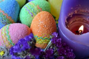 Colorful easter eggs with flowers in the plate. Beautiful easter background. Easter card. Homemade holiday decor. photo