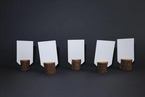 White empty cards with copy space in natural wooden stump. photo