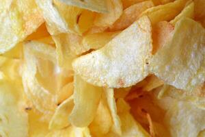 Chips background. Fried potatoes. photo