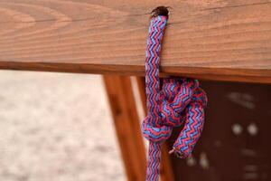 Knot on a colorful rope. Tools for climbing. photo