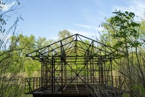 Steel construction on a water of lake. photo