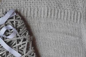 Knitted background. Grey knitted pattern. photo