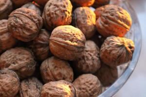 Lot of walnuts in the basket, close up. photo