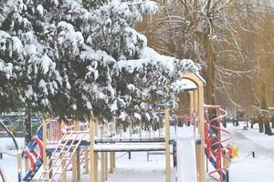 Winter playground kids. Snow in the street. Winter holiday. photo