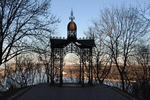 Forged arbor on the one of the most popular observation deck in Volodymyrska Gorka park. photo