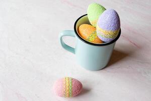 Easter egg in a cup. Beautiful easter background. Homemade holiday decor. photo