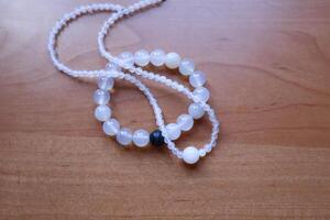 Necklace and bracelet from chalcedony and agate stone. The jewellery from minerals. photo