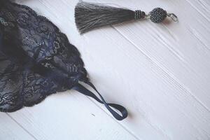 Lace lingerie and earrings on the white wooden table. photo