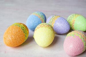 Easter eggs on a table. Beautiful easter background. Homemade holiday decor. photo