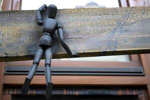 Little black manikins on a wooden boards. photo