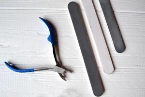 Tools for manicure. Manicure scissors on the white background. photo