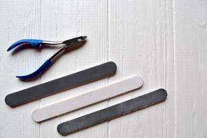 Tools for manicure. Manicure scissors on the white background. photo