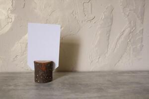White empty cards with copy space in natural wooden stump. photo