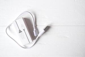 White USB cable on the desk. Usb isolated photo