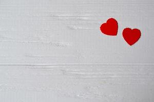 Love hearts on the white wooden background. Valentine's Day card photo